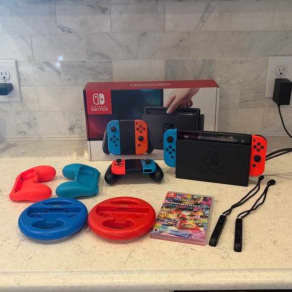 Nintendo Switch Console with Vibrant Red and Blue Controllers - Picture 2 of 8